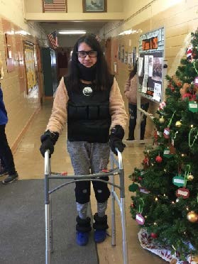 Student poses in a geriatric suit.